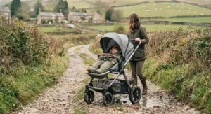 All-terrain best lie-flat seat buggy navigating a gravel pathway on a British countryside walk