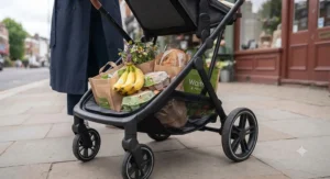 A spacious under-seat shopping basket on the best city pushchair filled with grocery bags.