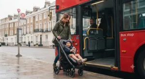 A commuter boarding a London bus with the best lightweight pushchair.