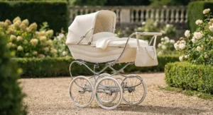 Elegant cream classic pram for a newborn with polished chrome chassis details.