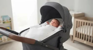 A newborn baby lying comfortably in the carrycot attachment of an affordable travel system pushchair, perfect for budget-conscious parents.