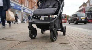 Close-up of wheels on the lightest pushchair under 6kg, highlighting ease of steering on busy British high street pavements.