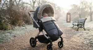 Cosy lie-flat pram equipped with a matching footmuff for warmth during cold British winter walks.