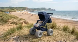 Durable pushchair with wide sand tyres parked on the dunes during a coastal holiday in the UK