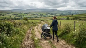 A pushchair high weight limit designed for older children tackling a muddy countryside trail on a family hike